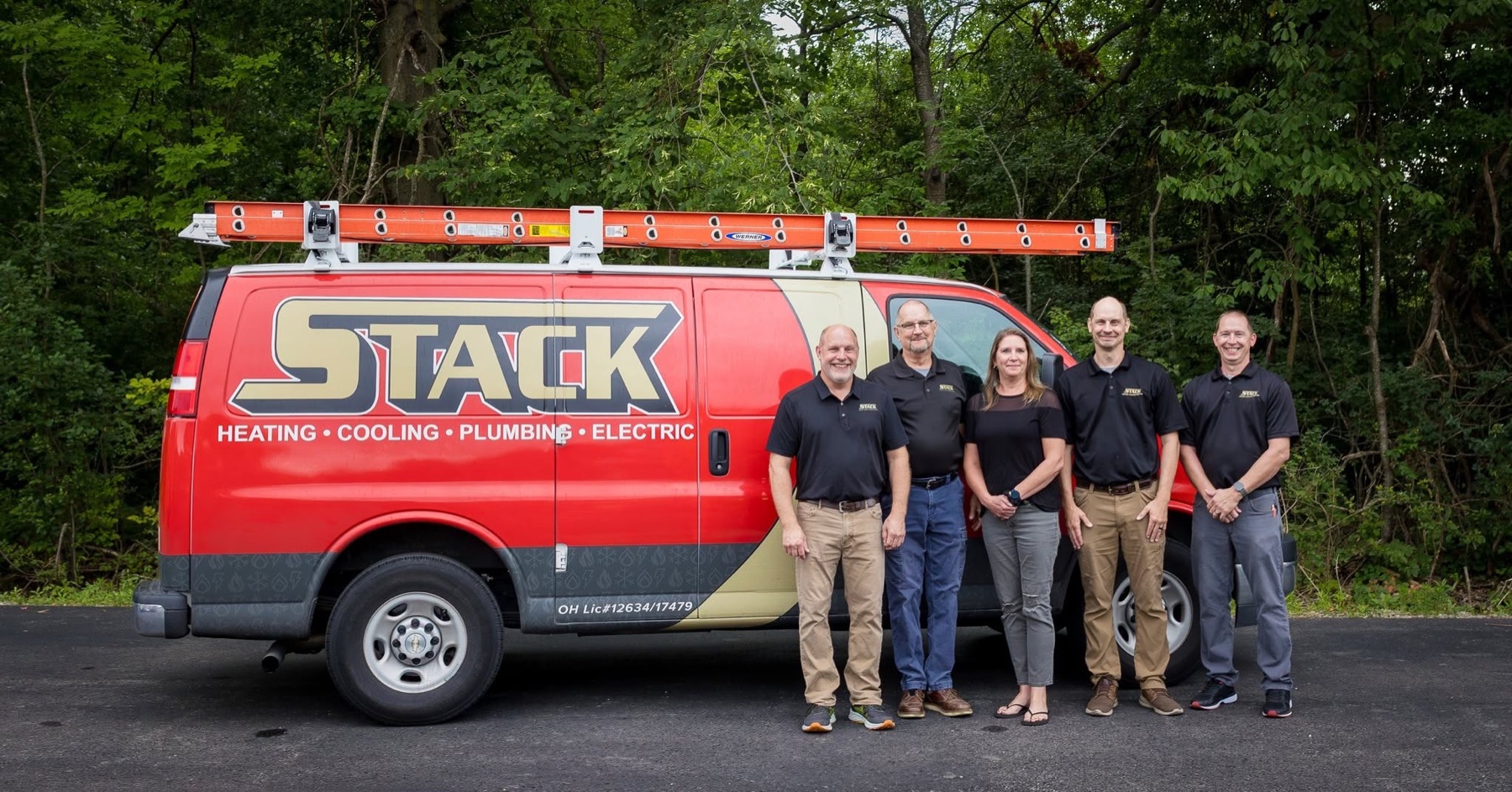 Brian Stack and family in front of a STACK van
