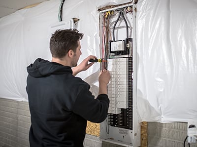 Stack electrician working on a home electrical job